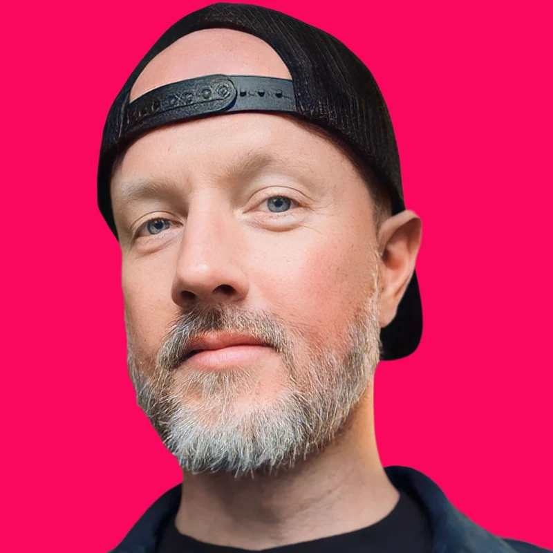 JoJo Riot, rock radio DJ, wearing a backwards cap